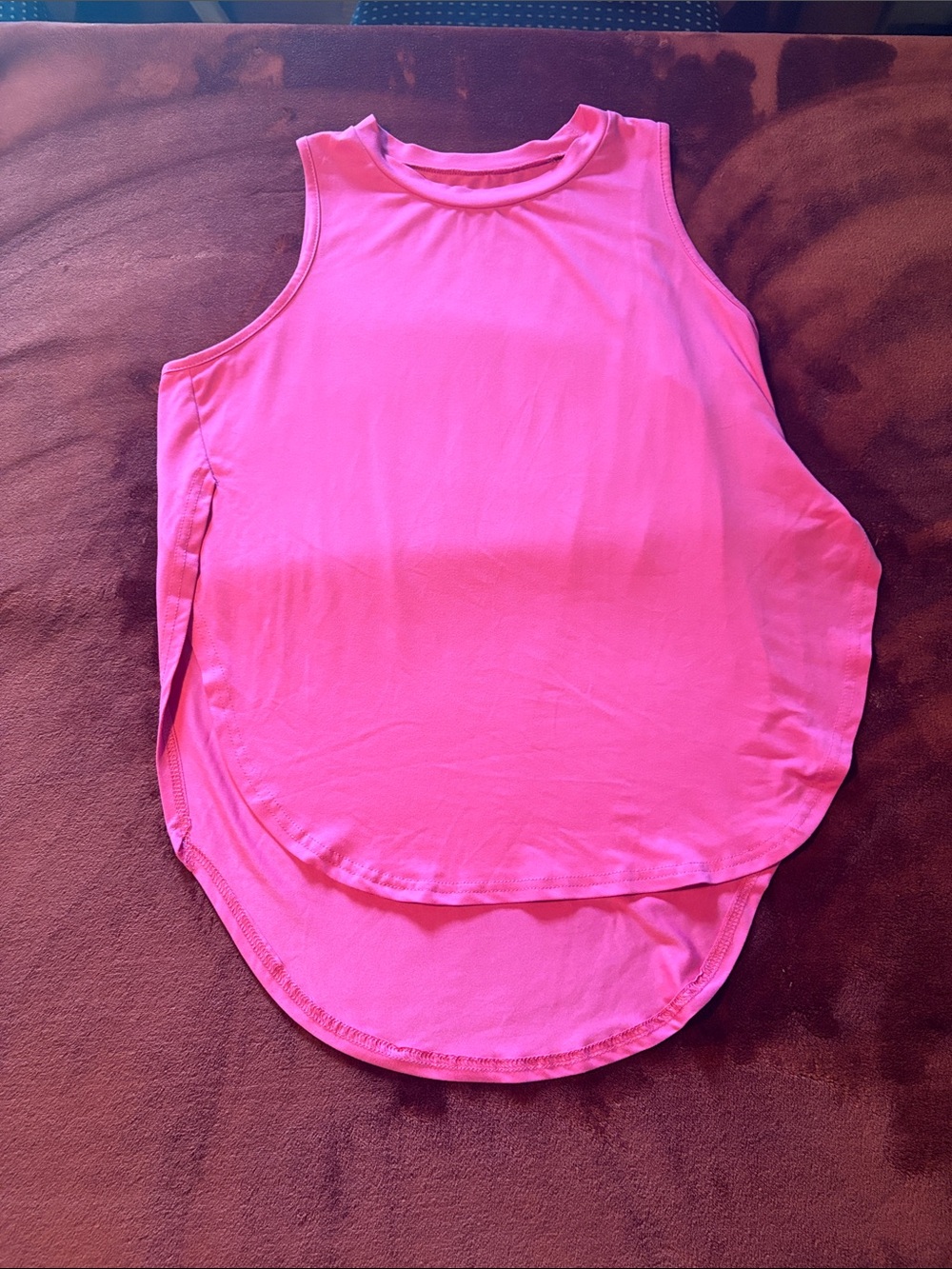 Pink open bottom tank top for sporty or dressy attire.
